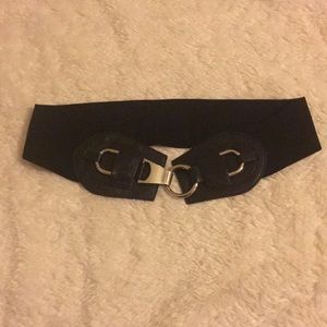 Black elastic waist belt with silver buckle.